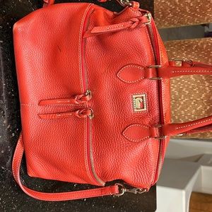 Dooney and Bourke all leather bag. Some scuffs noted in photos.